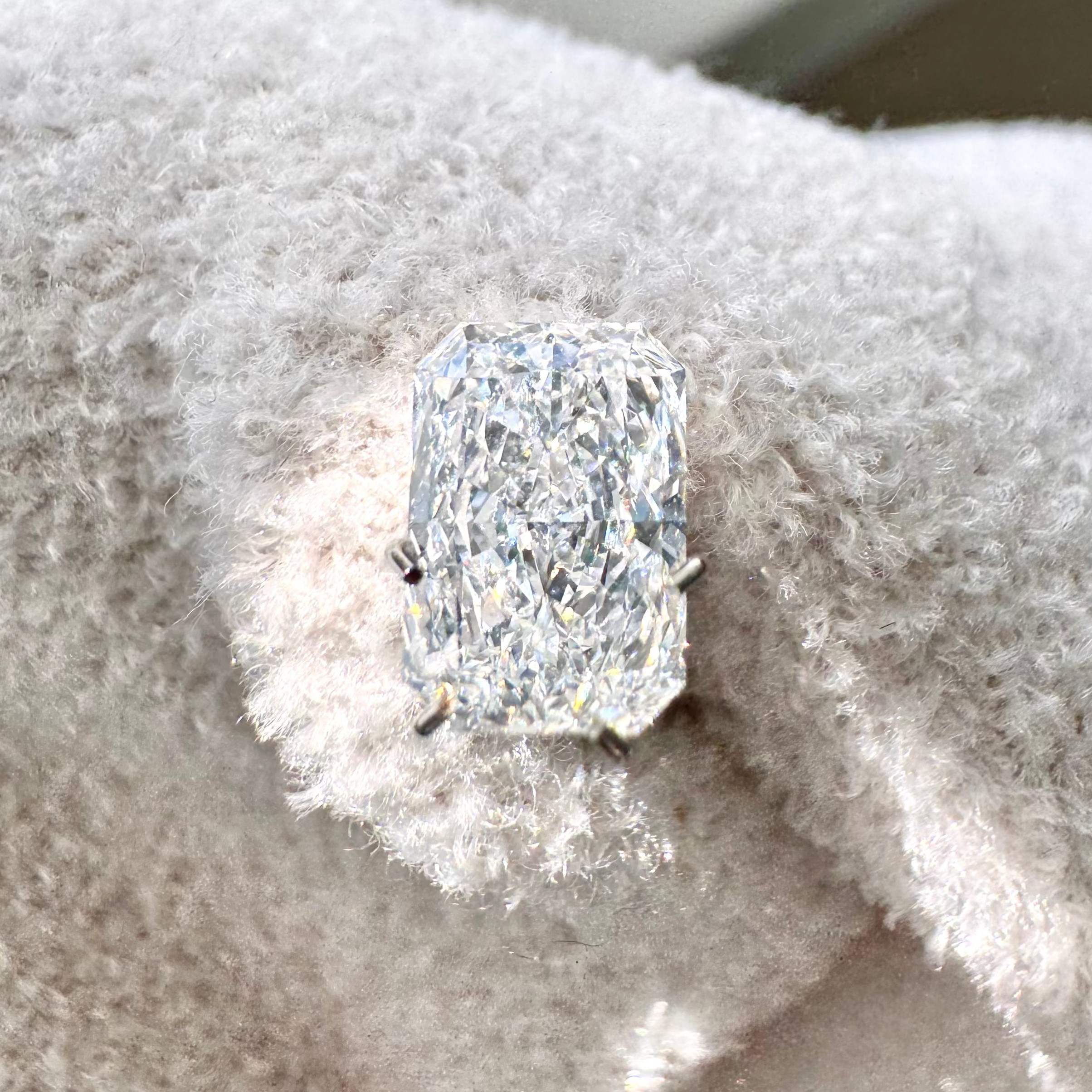 1.93 Radiant Cut Lab-Grown Diamond Near Light Colored Blanket