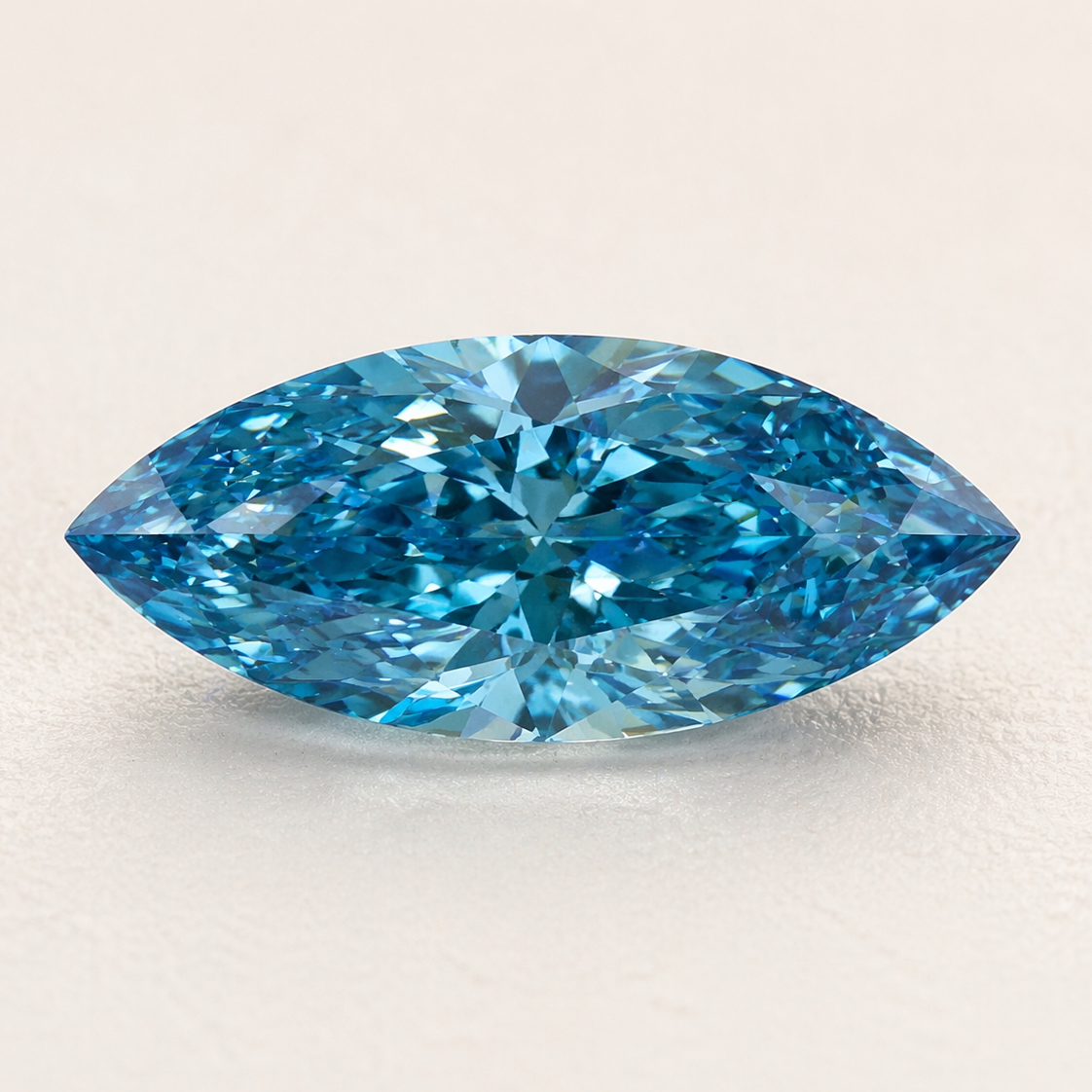 Blue diamond on a light beige background