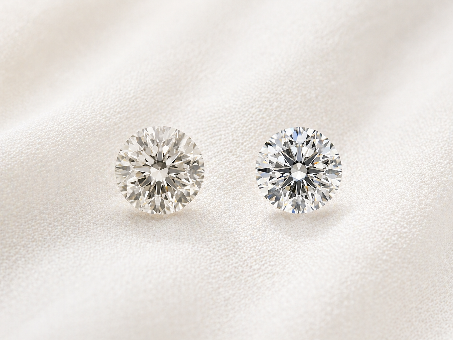 Two round diamonds on a light background